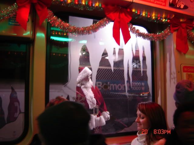 We were delayed at Belmont, so Santa stepped off to pose for pictures with customers.